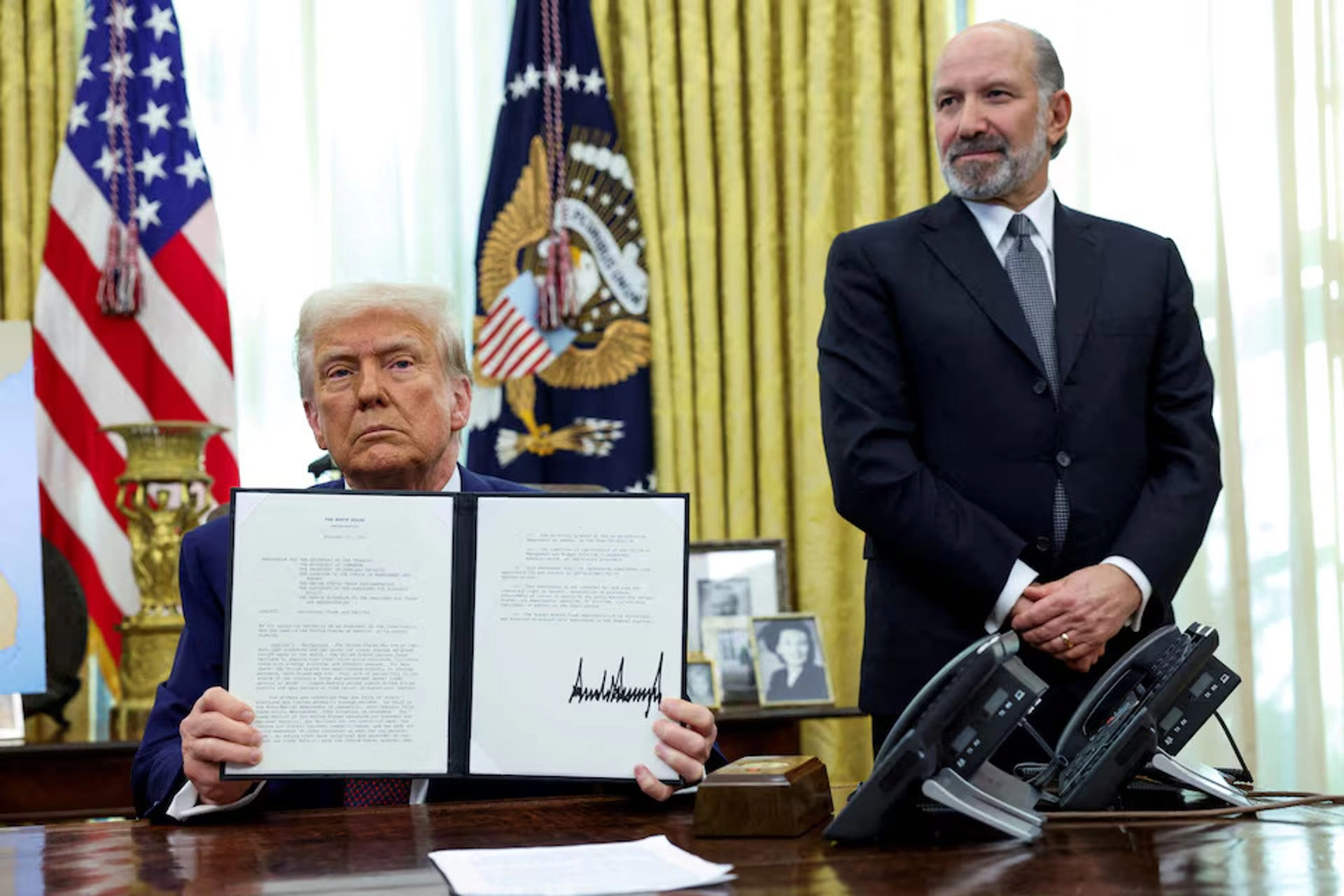President Donald Trump addresses journalists before signing a decree on healthcare pricing.