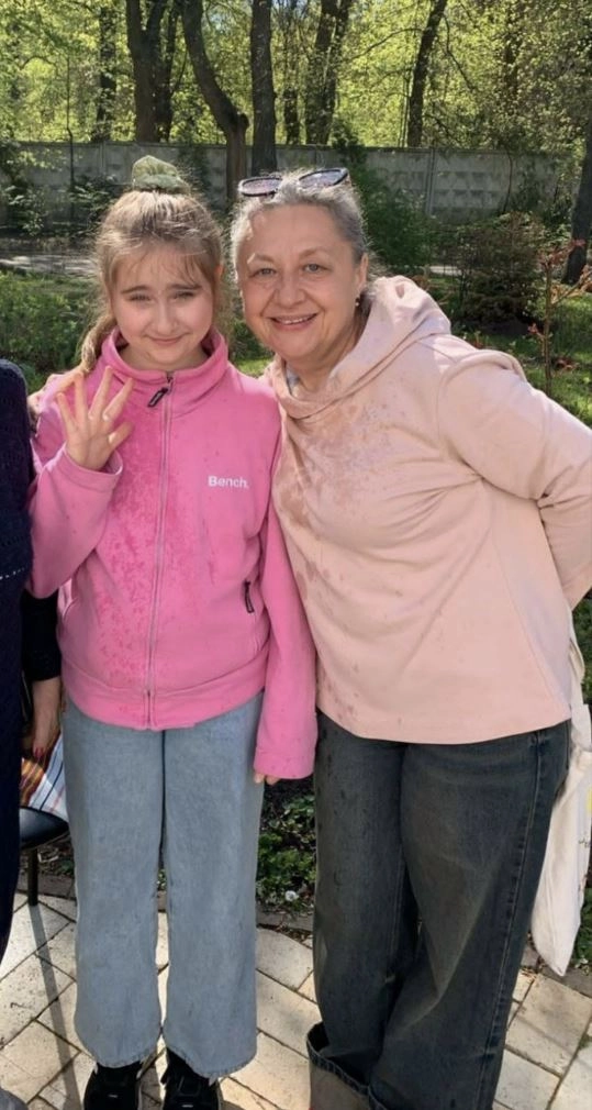Natalia with Yuliia Vlasova, whose mother was sentenced to 18 years in a penal colony and who remains in captivity